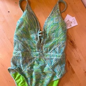 Becca size XL Crochet swimsuit, with see-through insets  and deep plunge neck.